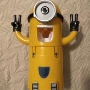 LE DISTRIBUTEUR MINION AUTOMATIQUE DE DENTIFRICE